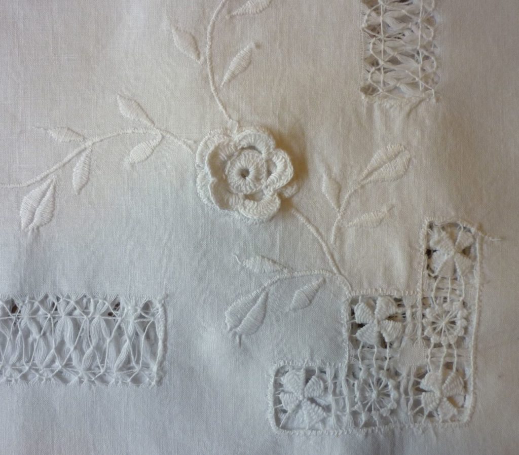 Beautiful vintage embroidered and crocheted linen tablecloth